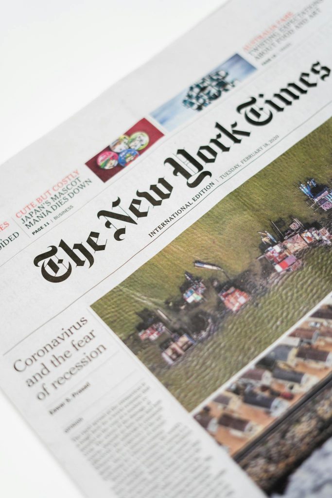 Detailed shot of New York Times newspaper featuring coronavirus and recession headline.