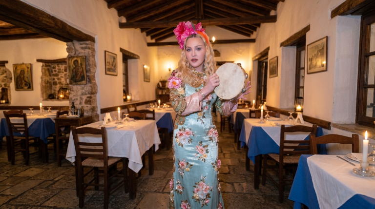Madonna Dances With a Tambourine in Corfu Taverna for Her Birthday
